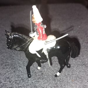 Soldier On Horse with Red and White Uniform...